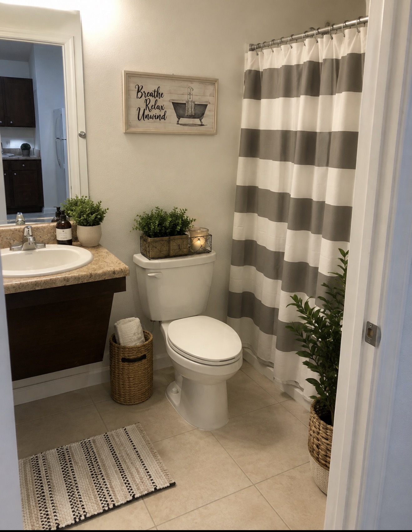Clean, updated villa bathroom with tile floor and vanity